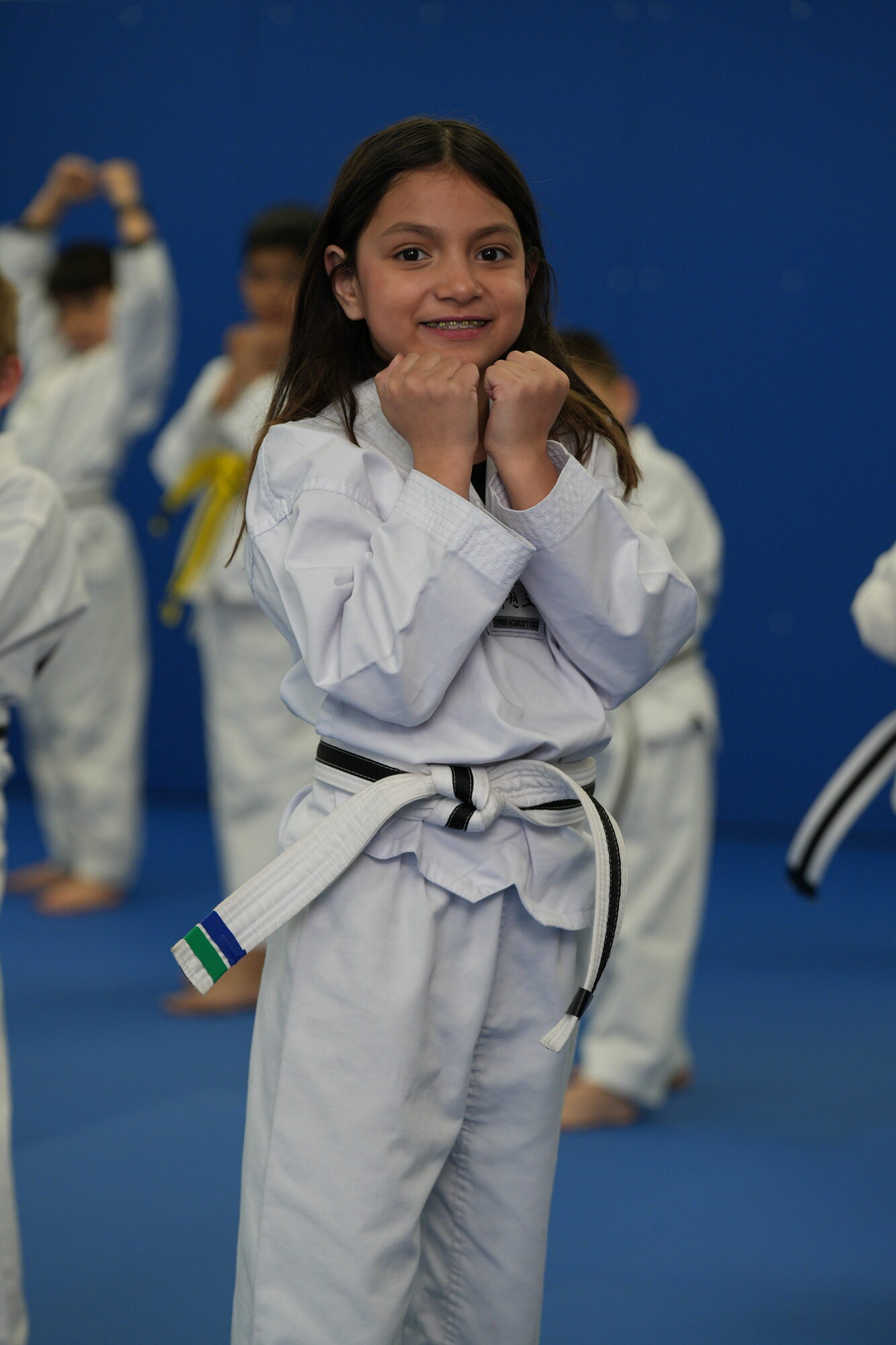 Young student learning Taekwondo